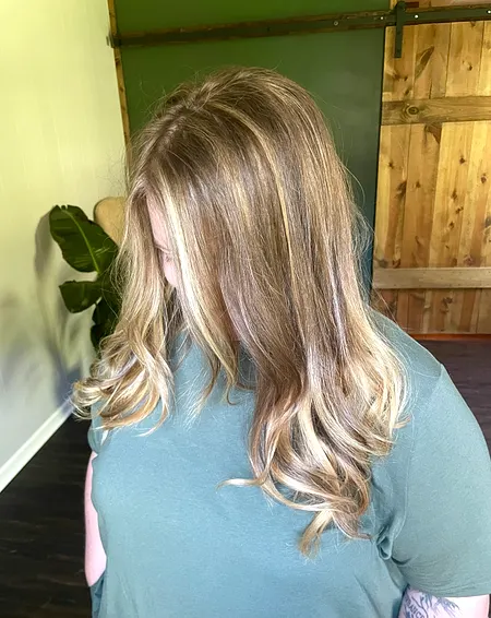 Brown to blonde balayage with soft curls
